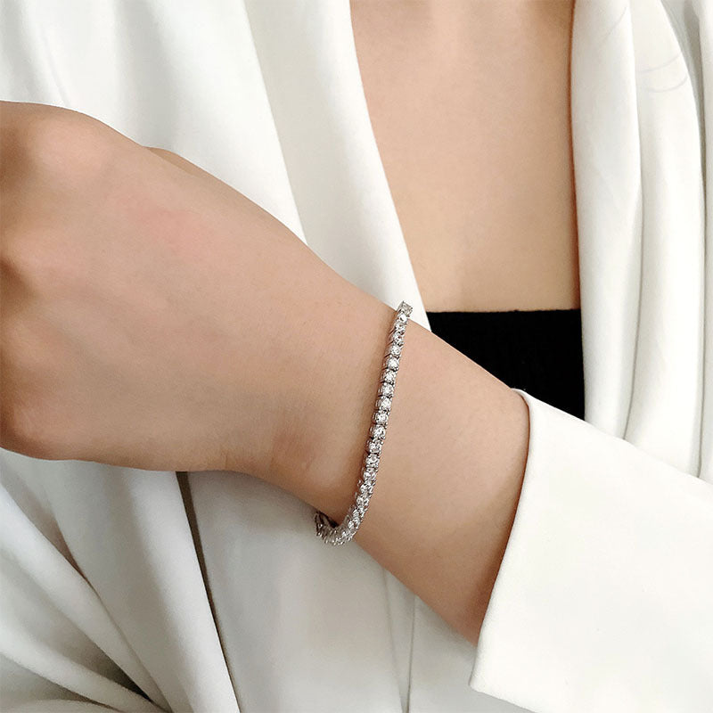 10 Points Moissanite Bracelet Tennis Chain on a woman's wrist with a stylish outfit, showcasing its elegance.